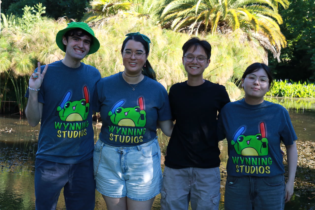 The Wynning Studios designers in the branded frog tee